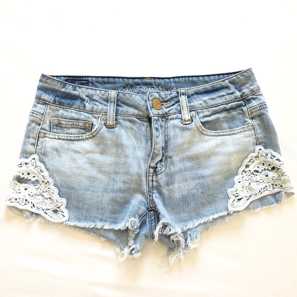 American Eagle Outfitters Pants - AMERICAN EAGLE • LIGHT WASH SHORTS W/ LACE TRIM
